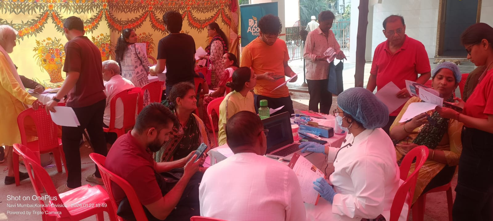 Busy screening area with medical staff and attendees